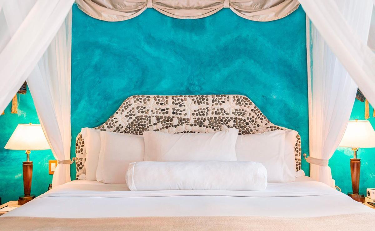 Dpny Beach Hotel & Spa Ильябела Экстерьер фото A bed with a headboard